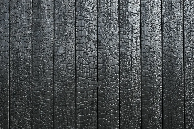 Yakisugi charred cedar fence with deep black finish in Tulsa residential yard